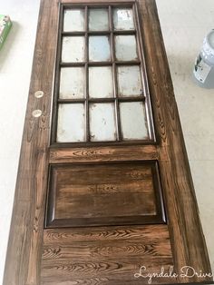 a wooden door with glass inserts on it