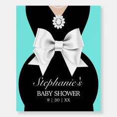 a baby shower sign with a white bow on it's belly and the words stephanie's baby shower