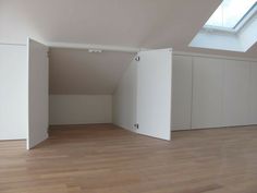 an empty room with white walls and wooden floors is seen in this image from the inside