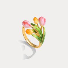 Blossoming like a vibrant vernal dream, the Enamel Tulip Ring encapsulates nature's ephemeral artistry in eternal radiance. Finely sculpted in luxurious 18K gold over brass, its petals unfurl in lush enamel hues that capture the tulip's kaleidoscopic splendor. A brilliant cubic zirconia center glistens like morning dew, beckoning the wearer to embrace the awakening of their most authentic, luminous self. A talisman of rebirth and renewal, this ring encircles the finger with the grace of spring's Luxury Fine Jewelry Enamel Ring, Luxury Fine Jewelry Enamel Promise Ring, Luxury Jewelry With Spring Ring Clasp For Gift, Luxury Gold Enamel Ring For Gift, Luxury Enamel Open Ring Jewelry, Luxury Gold Enamel Gift Ring, Luxury Enamel Ring Gift, Luxury Enamel Promise Ring In Fine Jewelry Style, Luxury Elegant Enamel Ring Gift