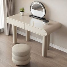 a white table with a mirror and stool