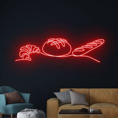 a living room with a couch, chair and neon sign in the shape of a bird