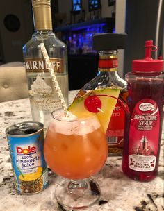 various alcoholic drinks on a marble counter top