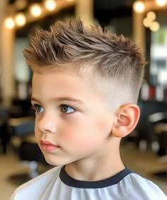 Stylish, Messy and Textured Short Hair with Mid Fade. This trendy short boy’s haircut is effortlessly stylish, versatile and school-appropriate, making it the perfect style to experiment with at your kid’s next barber appointment. A cool hairstyle for your little one will support your son’s confidence while allowing his look to reflect his personality. Save this cut and show the photo to his stylist to copy the look. Popular Boys Haircuts, Trendy Boys Haircuts, Mohawk Haircut