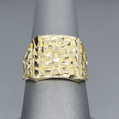 GOLD: 10kt yellow gold   WEIGHT: 4.3 grams   HEIGHT: 0.60 inch    WIDTH: 0.60 inch   SIZE: 10 (can be resized) Hammered 14k Gold Rings, 14k Gold Hammered Rings, Engraved 14k Yellow Gold Ring With Diamond Cut, Classic Gold Nugget Ring, Hammered Yellow Gold 14k Signet Ring, Hammered 14k Yellow Gold Signet Ring, Hammered Gold Signet Ring In 14k, Hammered 14k Gold Signet Ring, Gold Diamond Cut Signet Ring In Fine Jewelry Style