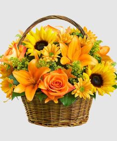 a basket filled with orange and yellow flowers