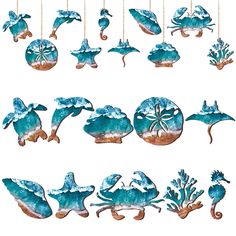 an assortment of sea animals hanging from strings on a white background with blue watercolors