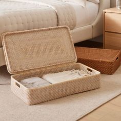 an open suitcase sitting on top of a rug next to a bed