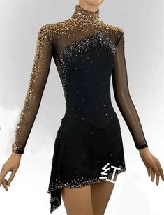 a woman wearing a black dress with gold sequins on the neck and sleeves