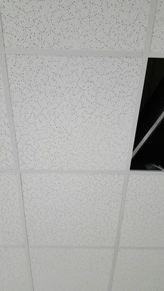 the ceiling is covered with white speckles