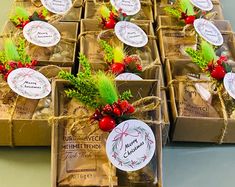 several boxes filled with different types of christmas treats and decorations on top of each other