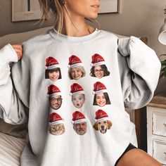 a woman wearing a christmas sweater with pictures of people on the front and back in santa's hats