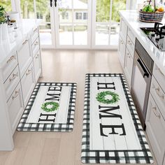 two kitchen mats with the words home and wreath on them in black and white checkered pattern