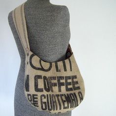 a mannequin holding a coffee bag on it's back