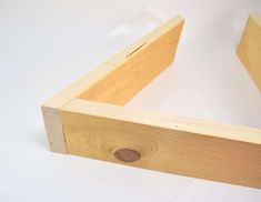 a wooden box sitting on top of a white table