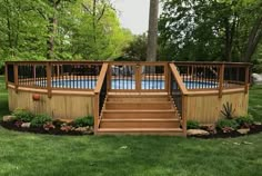 an above ground pool with steps leading up to the deck and above ground swimming pool