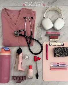 the contents of a woman's personal care bag laid out on a marble surface