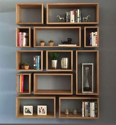 the bookshelf is made out of wood and has many shelves