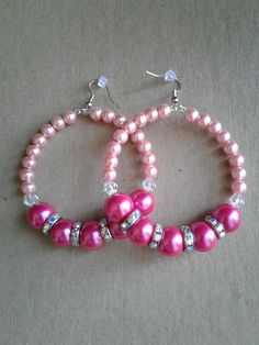 Pink pearl beaded hoop earrings...using light pink pearl beads, hot pink pearl beads, clear bicone beads, and rainbow colored rhinestone spacers.  Measurements: 3 inches in length.. Has some weight to them, but they won't bog your ears down! Thanks for looking :-) Pink Large Bead Dangle Earrings, Pink Dangle Earrings With Large Beads, Pink Large Beaded Dangle Earrings, Pink Large Beads Dangle Earrings, Pink Dangle Beaded Earrings With Large Beads, Pink Dangle Beaded Earrings With Spacer Beads, Pink Hoop Beaded Earrings For Party, Pink Colorful Beaded Hoop Earrings For Parties, Handmade Pink Pearl Earrings