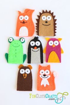 six felt animals with eyes and noses on them