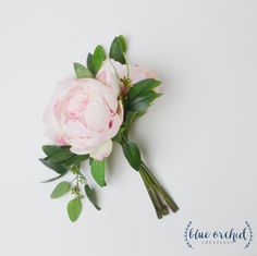 a bouquet of pink flowers with green leaves