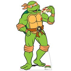 the teenaged ninja is eating pizza while wearing his turtle suit and holding it in one hand