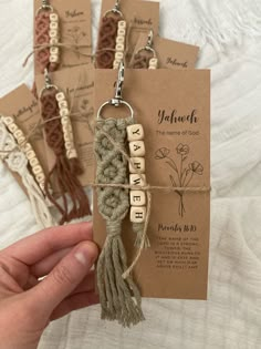 handmade keychains with words and tassels attached to them