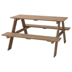 a wooden picnic table with two benches underneath it