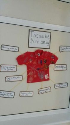 a white frame with a red shirt on it's side and labels attached to it