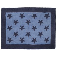 a blue and black rug with stars on the front, in various sizes and colors