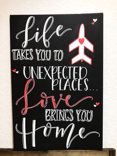 a sign that says life takes you to unexpected places love brings you home