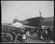 an old black and white photo of people watching a ship