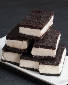 several pieces of cake sitting on top of a white plate