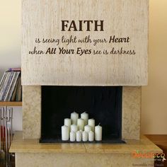 a fireplace with candles and a sign that says, faith is seeing light with your heart when all your eyes are darkness