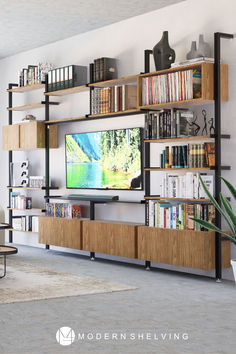 a living room filled with furniture and a large flat screen tv mounted on a wall