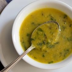 a bowl of soup with a spoon in it