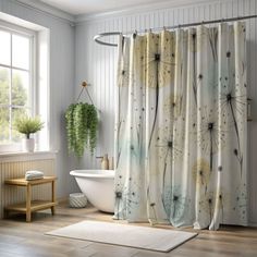 a dandelion shower curtain in a bathroom next to a bathtub and window