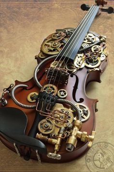 an old violin with gears attached to it