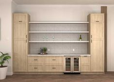 an empty kitchen with white brick walls and wooden cabinets in the center is a potted plant