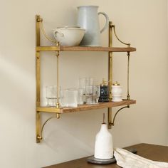 a shelf with glasses and cups on it