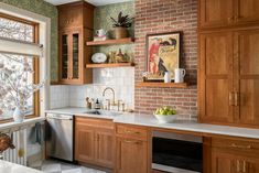 a kitchen with wooden cabinets and white counter tops, along with an open window to the outside