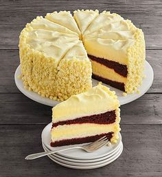 two slices of cake on plates with forks