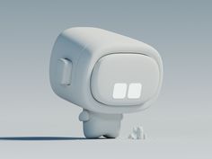 a small white object with two windows on the front and back sides, sitting in an empty space