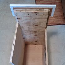 an open wooden box sitting on top of a table