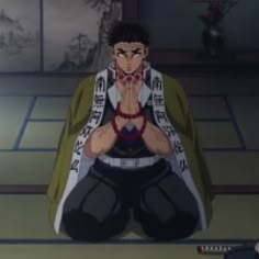 an anime character sitting on the floor with his hands together