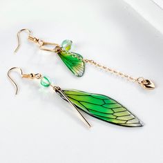 Fashion Earrings-Korea Style Asymmetrical Fresh Fairy Simulation Wing Clip on Earrings Non Pierced Insect Butterfly Wing Earringas for Girl WomenModel Number:4001190560995 Material:alloy+resin epoxy+glass+glitterMetal:ancient copper/goldplated Color: purple/green/orange/blue/rainbowPattern: Cicada WingsStyle:Vintage/Ethnic/RomanticFunction: Jewelry&AccessoriesApplication: Women PackageIncludes: 1pair/opp bag Sales Green Fairy Earrings For Gift, Butterfly Wing Earring, Butterfly Wings Earrings, Unique Green Butterfly Earrings, Fairy Wing Earrings, Butterfly Fairy Wings, Fairy Butterfly, Yellow Gradient, Feminine Earrings