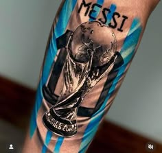 a man with a tattoo on his arm holding a soccer ball and the word messi