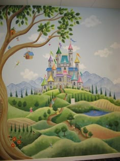 a mural on the wall of a children's room with a castle in the background