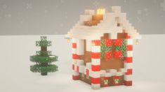 a small house made out of legos with christmas decorations on the front and side