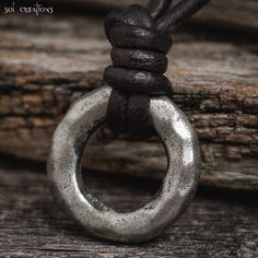 "Mens leather cord ring necklace, handmade with dark brown 2.5mm leather cord and a rustic pewter ring pendant.  Rugged, timeless, and durable... as a man's necklace should be. Pendant size: 24mm (0.95 inch).  I use only the highest quality leather cord available on the market. It obtains its color through a natural dye process, which enables it to maintain its rich, natural leather look and feel. I use a high quality conditioner on all leather before using. Will be handcrafted, when ordered, by Mens Leather Necklace, Cord Wood, Pewter Ring, Leather Cord Bracelets, Jewelry Design Drawing, Surfer Necklace, Mens Leather Bracelet, Men Jewelry, Gift For Husband